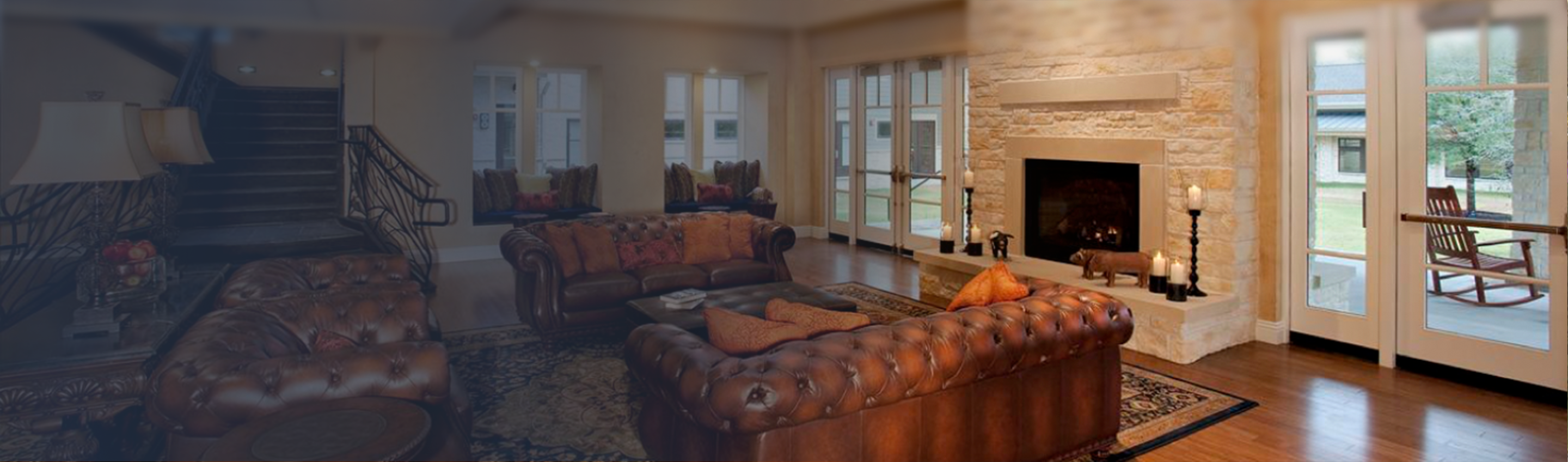 Common area at a Ronald McDonald House program, fireplace, rug, and three leather sofas organized around them, left to right in background, a lamp, grand staircase leading upward, glass doors leading to exterior deck with rocking chair